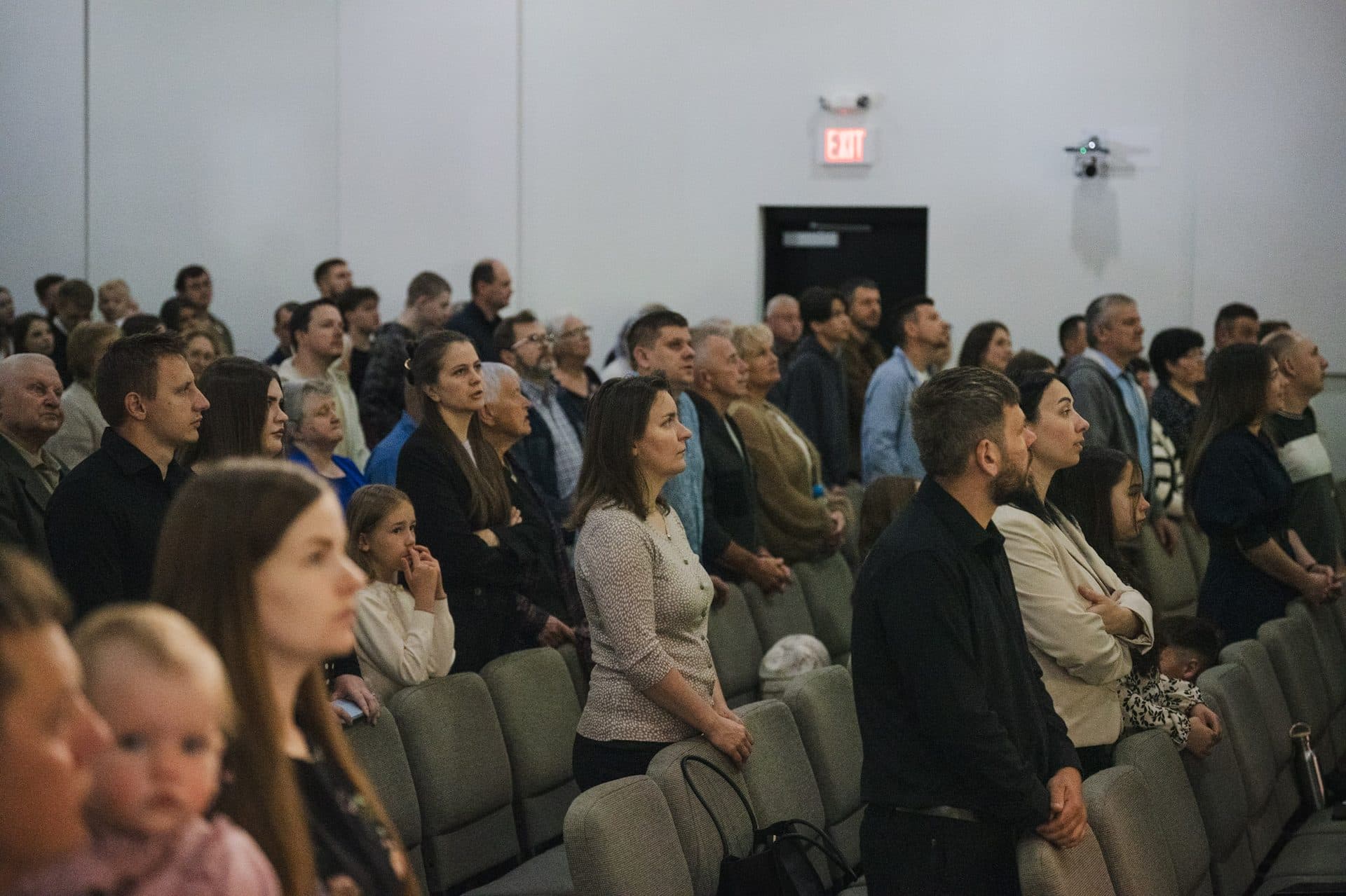The Ark Church family standing together in Sunday worship